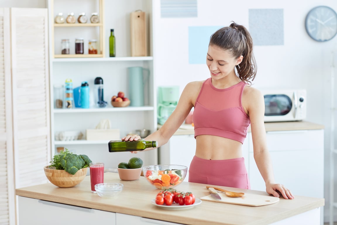 Smiling Young Woman Cooking Healthy Food